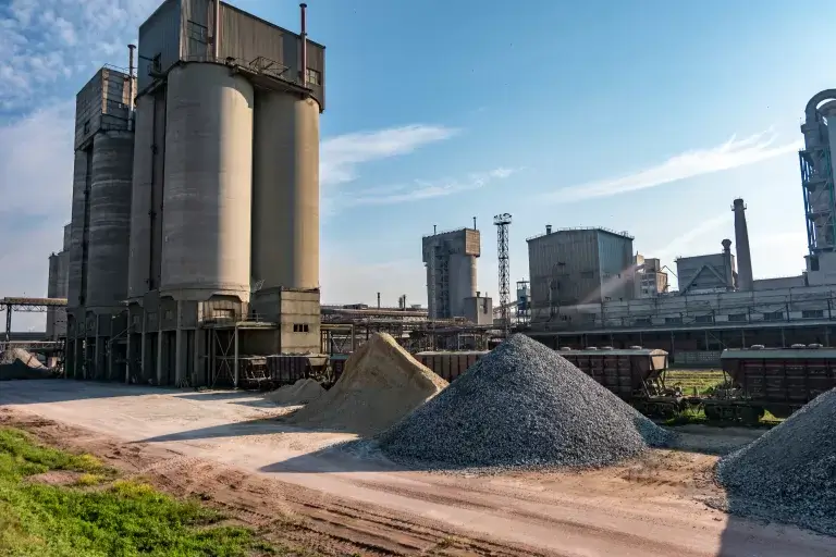 industrial-grey-landscape-environmental-pollution-waste-cement-factory-big-pipes-industry-enterprise-plant-mountains-sand-rubble-768x512-jpg